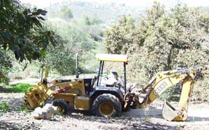 Backhoe on septic system job